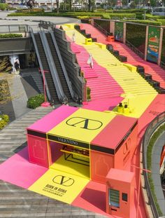 an aerial view of a building with colorful stairs