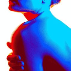 a woman with her back turned to the side, in blue and red light from behind