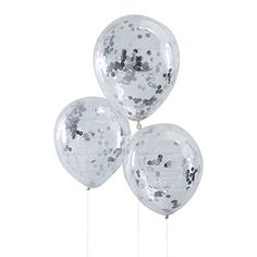 three clear balloons with silver confetti on them