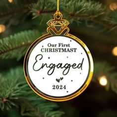 a personalized ornament hanging from a christmas tree