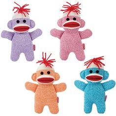 three stuffed animals with red hair on their heads