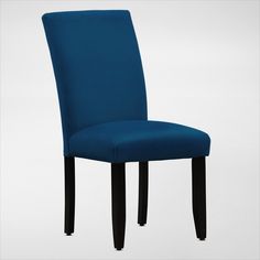 a blue upholstered chair with black legs and wood trimming on the back