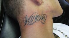 a man with a tattoo on his neck that reads, wisconsin in cursive writing