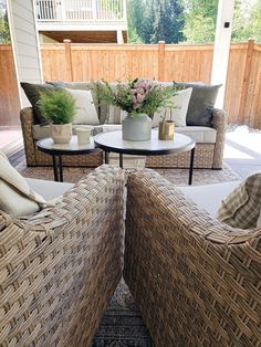 some wicker furniture sitting on top of a patio