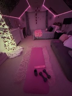 a bedroom with pink carpet and lights on the ceiling