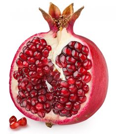 the pomegranate is cut in half and ready to be eaten