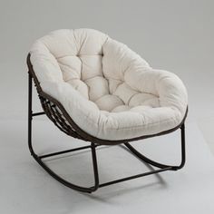 a rocking chair with a white cushion on it