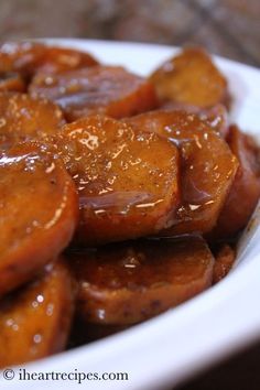 a close up view of some food on a plate with sesame seeds and sauce over it