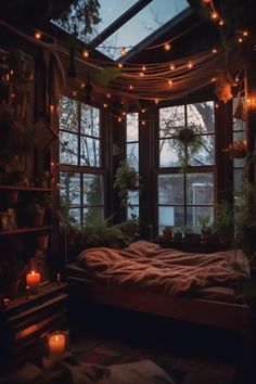 a bedroom with lots of lights and plants in the window sill above the bed