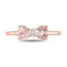 Express your sweet personality and feminine style with this cute heart-shaped pink morganite and diamond accent bow ring in rose gold. Fashioned in precious 10K rose gold This look glistens with a pair of mirrored 5.0mm heart-shaped soft-pink morganites. The diamond-accented center adds a hint of shimmer to this bow design. Tiffany Bow Ribbon Engagement Ring, Bow Diamond Ring, Pink Heart Diamond Ring, Bow Engagement Ring, Sweet Personality, Gold Book, Morganite Diamond, Bow Ring, Pink Morganite