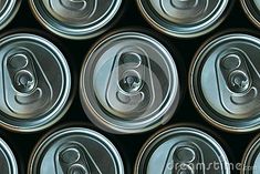 many cans of soda are stacked together