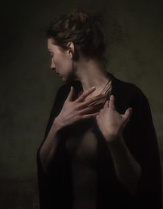 a woman with her hands on her chest