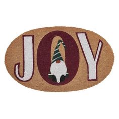 a door mat with the word joy and a gnome hat on it's head