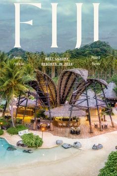 the front cover of fiji magazine, with palm trees and thatched huts in the background