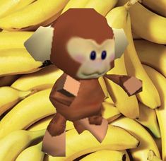 a bunch of bananas with a cartoon monkey on it's chest and some other bananas in the background