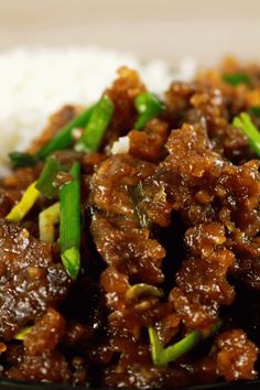 a close up of food on a plate with rice