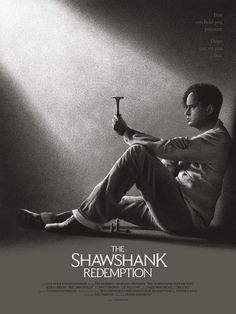 a man sitting on top of a chair in front of a wall with the words, the shaw shank redemption