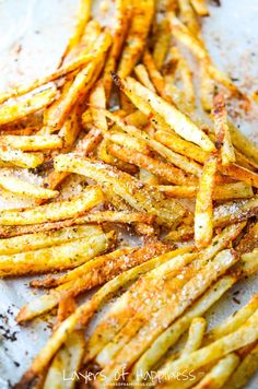 seasoned french fries with seasoning sprinkled on top