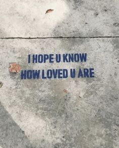 a sign on the sidewalk that says, i hope u know how loved u are