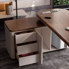 an office desk with drawers underneath it