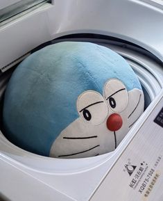 a close up of a stuffed animal in a dryer