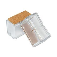 an open plastic container with cork lid