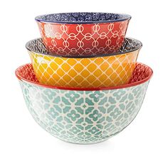 four colorful bowls stacked on top of each other