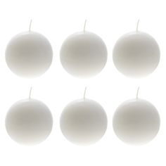 six white candles are lined up in the shape of an eight - sided ball on a white background