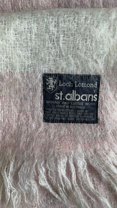 This Gorgeous lightweight warm and cozy Mohair and Lustre Wool Throw was made in Australia. Measures 30" wide x 45" long including fringe.   Excellent condition. Lovely, muted shades of Pink, & Cream and the lightest purple gray tones.  You will not be disappointed in this! Smoke free and pet free home. Here is a bit from the St. Alban's Company -  Quality. Beauty. Heritage. Proudly Australian owned and operated by the Gough family since 1951, St Albans manufactures with the highest quality, responsibly sourced materials to produce the finest throws, blankets and scarves with experience, dedication and pride. Every St Albans piece blending practicality, comfort and pleasure to meet our unwavering standard of excellence. Mohair Blanket, Pink Throws, St Albans, Loch Lomond, Mohair Wool, Wool Throw, Purple Grey, Warm And Cozy, Blankets & Throws