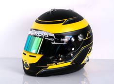 the helmet is black and yellow with a blue stripe on it's side,