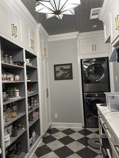 a laundry room with an open shelving unit and black and white checkered floor