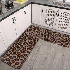 two leopard print rugs on the kitchen floor