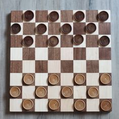 a wooden chess board with circles on it