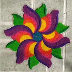 the colorful flower is painted on the tile