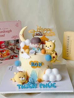 a birthday cake decorated with teddy bears and other items