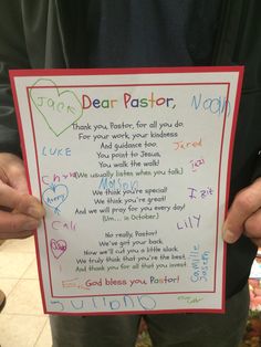 a person holding up a sign with writing on it that says dear pastor, thank you pastor for all you do