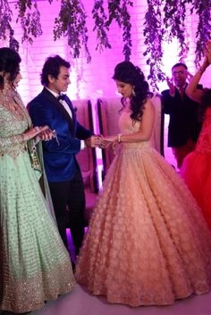 the bride and groom are getting ready to walk down the aisle at their wedding reception