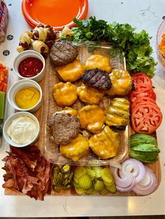 an assortment of food is displayed on a cutting board