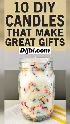 a jar filled with cake batter and sprinkles on top of a table