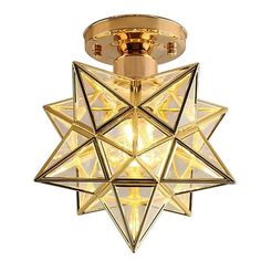 a ceiling light with a star design on the top and bottom, hanging from a ceiling fixture