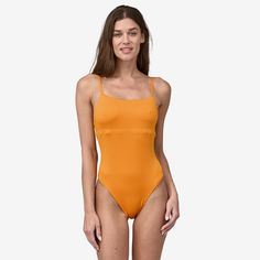 Our bandeau-inspired, reversible one-piece swimsuit has a versatile strap system that can be worn tied over the shoulders or crossed in back for a more secure fit. Made in a Fair Trade Certified™ factory. | Patagonia Women's Reversible Sunrise Slider One-Piece Swimsuit in Kishu Orange, Large - Surf Swimwear - Recycled Nylon/Recycled Polyester/Spandex Summer Swimwear With Built-in Bra And Tank Straps, Trendy Stretch Swimwear With Straps, Solid Bandeau Swimwear With Straps, Trendy Bandeau Swimwear With Adjustable Straps, Beachwear Swimwear With Tank Straps For Pool, Solid Color Beachwear Swimwear With Straps, Solid Beachwear Swimwear With Straps, Nylon Tankini With Adjustable Straps For Sunbathing, Beachwear Swimwear With Straps