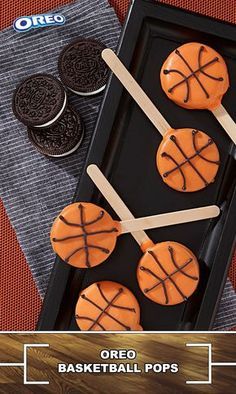 oreo basketball pops are arranged on a tray