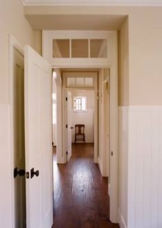 the hallway is clean and ready to be used for storage or remodeling