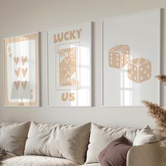 a living room filled with furniture and pictures on the wall