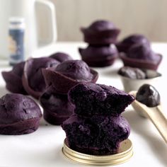 blueberry muffins are stacked on top of each other and ready to be eaten