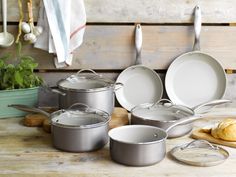 an assortment of pots and pans on a table