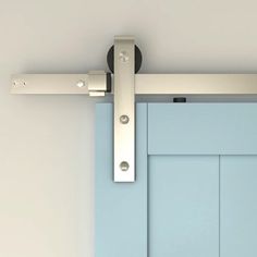 a blue door with a metal handle on the top and bottom bars attached to it