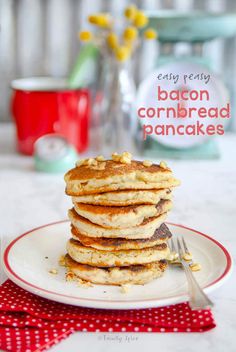 a stack of pancakes sitting on top of a white plate