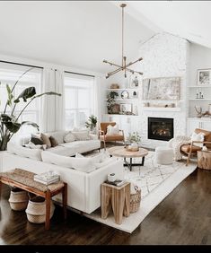 a living room filled with furniture and a fire place