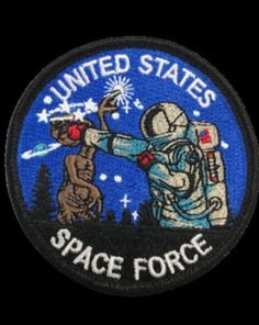 the united states space force patch with an astronaut and a dog on it's back